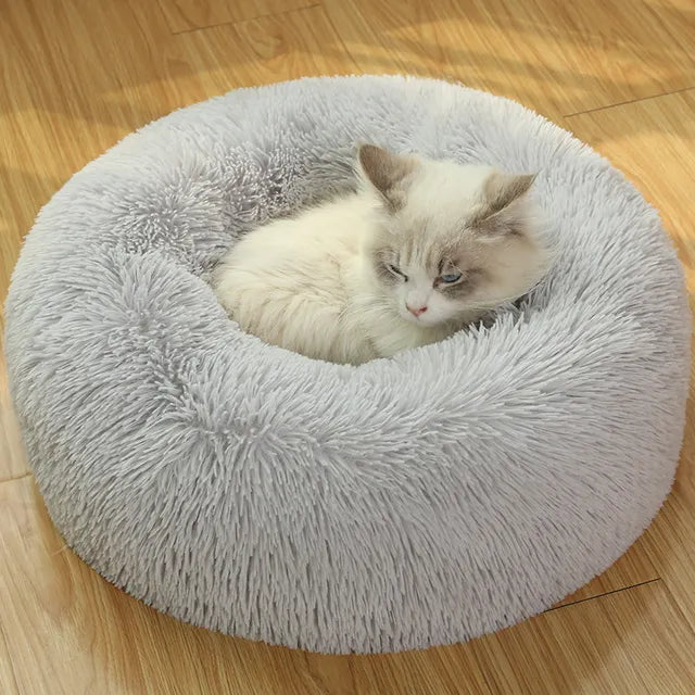 Cama redonda de felpa para gatos y perros, con forma de donut, nido profundo y suave para dormir.