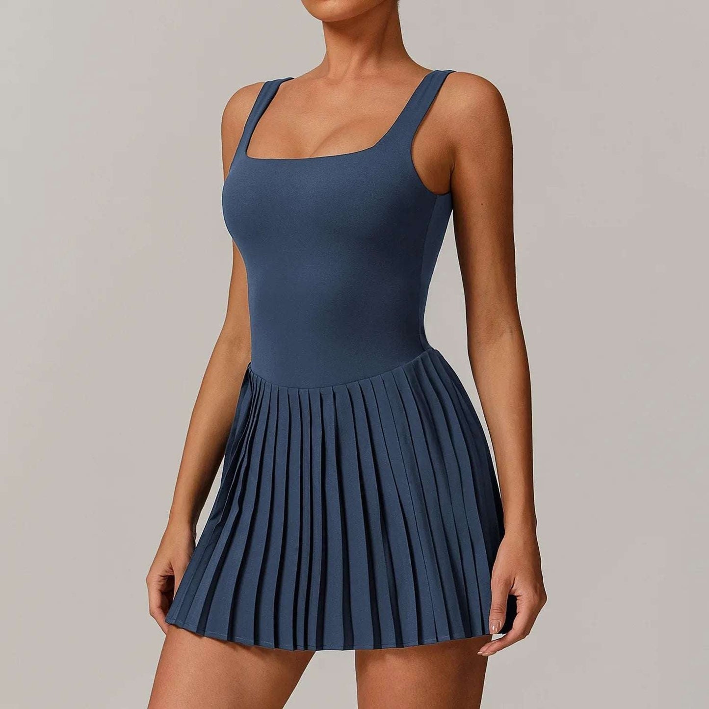 Falda de tenis plisada antideslizante para mujer. Pantalón corto integrado con bolsillos laterales funcionales. Vestido deportivo con ajuste perfecto para gimnasio.