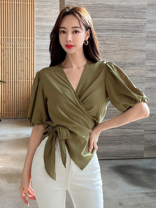 Blusa cruzada con nudo lateral y mangas abullonadas DAZY